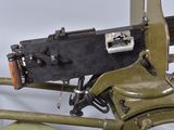a machine gun mounted on the back of a motorcycle