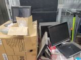 a pile of computer equipment sitting on top of a pile of boxes