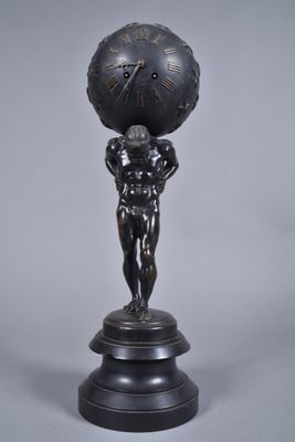 statue of a man holding a clock on his head