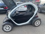 a small car that is parked in a parking lot