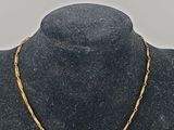 a gold chain necklace on a mannequin mannequin mannequin mannequin mannequin mannequin mannequin mannequin manne