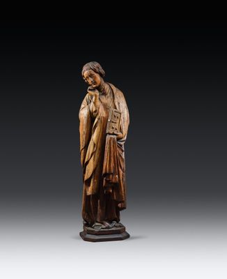 a carved wooden statue of a woman holding a child