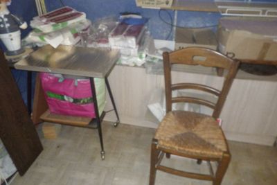 a chair and a table in a small room