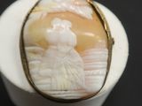 a picture of a ring with a picture of a woman on it