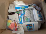 a cardboard box filled with toys and other items