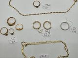 a group of gold jewellery including rings, bracelets, and rings