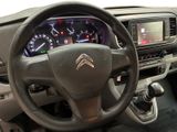 dashboard of a car with a steering wheel and a dash light