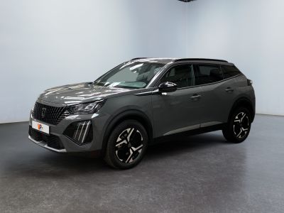 a grey suv is parked in a large room