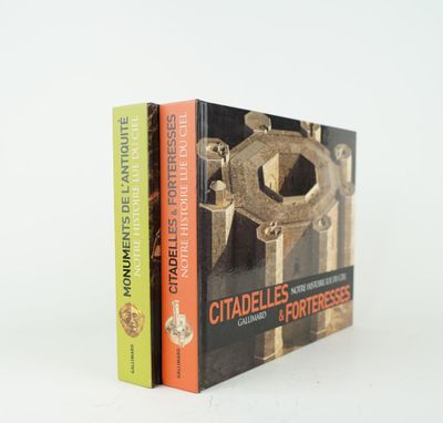 two books sitting on top of each other in front of a white background