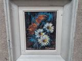 une photo d'un tableau représentant des fleurs, dans un cadre blanc