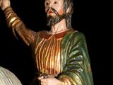 a statue of a man riding a horse holding a sword