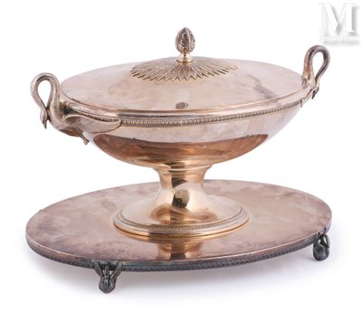 a silver plate with a bowl on it on a stand