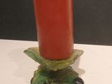candlestick holder in the shape of a turtle with a red candle