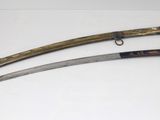 two old swords are displayed on a white surface