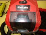 a red machine that is sitting on a table