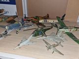 a lot of toy airplanes that are on a table