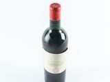 a bottle of wine that is sitting on a table