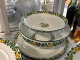 several plates and bowls are stacked on top of each other on a table