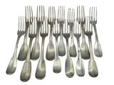a lot of forks that are sitting on a table