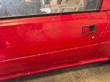 a red car that is parked in a garage