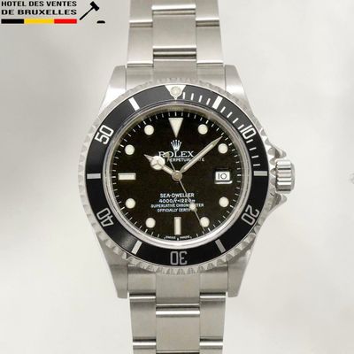rolex submarine watch with black dial and bezeled bezel