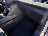 dashboard of a car with black leather seats and dashboard controls