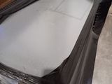 a lot of black plastic sheets on the floor