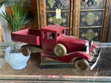 a red toy truck sitting on a glass coffee table