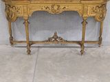 a gold table with a mirror on top of it