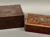 pair of antique wooden boxes with metal decoration on top of them