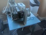 a machine that is sitting on a table by a window