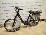 a bike that is parked in front of a wall