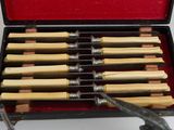 a box with a bunch of wooden chopsticks in it
