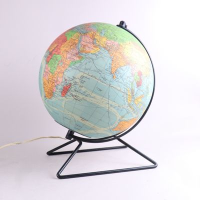 a globe that is on a stand with a cord