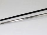 two swords on a white table with a black handle