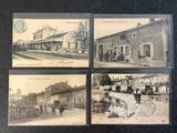 four old postcards of a train station with people walking on the tracks