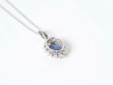 an image of a blue sapphire and diamond pendant on a silver chain