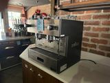 a coffee machine sitting on a counter in a kitchen