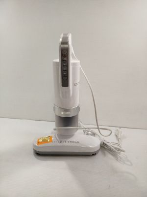 someone is using a vacuum cleaner to clean a counter top