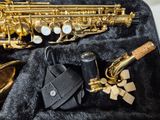 a saxophone and other musical instruments in a case