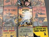 a lot of comic books that are on the table