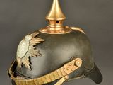 an old helmet with a bird on the top of it