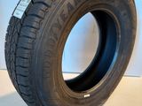 a close up of a tire on a white surface with a white background