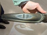 a person that is holding a metal object in his hand