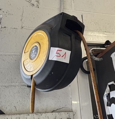 a picture of a black and yellow fire hydrant on a wall