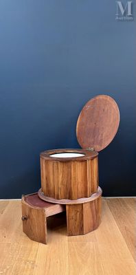 a wooden stool with a bowl on top of it