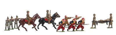 many figurines of men riding on horses and horses