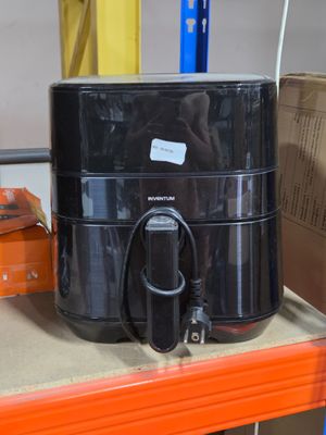 a large black container sitting on top of a shelf