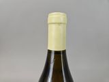 a bottle of wine that is sitting on a table
