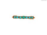 une image représentant une bague sertie d'une pierre turquoise sur fond blanc